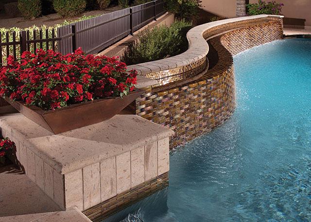 https://luxurypools.com/ezoimgfmt/luxpools.wpenginepowered.com/wp-content/uploads/2018/05/Size-Alpentile-LLC-Oceanside-Glass-tile-freeform-pool-planter-water-feature-Fountain_0_0.jpg?ezimgfmt=rs:640x457/rscb1/ngcb1/notWebP