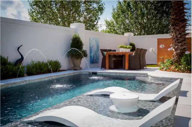 ledge lounger: the ultimate “in-water” pool furniture - luxury pools