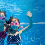 young children swimming