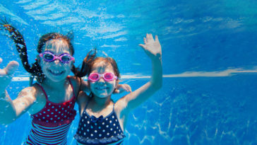 young children swimming